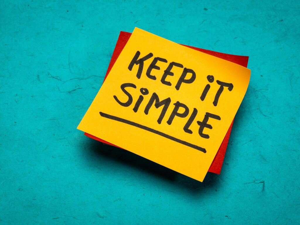 A sticky note with the words written, keep it simple